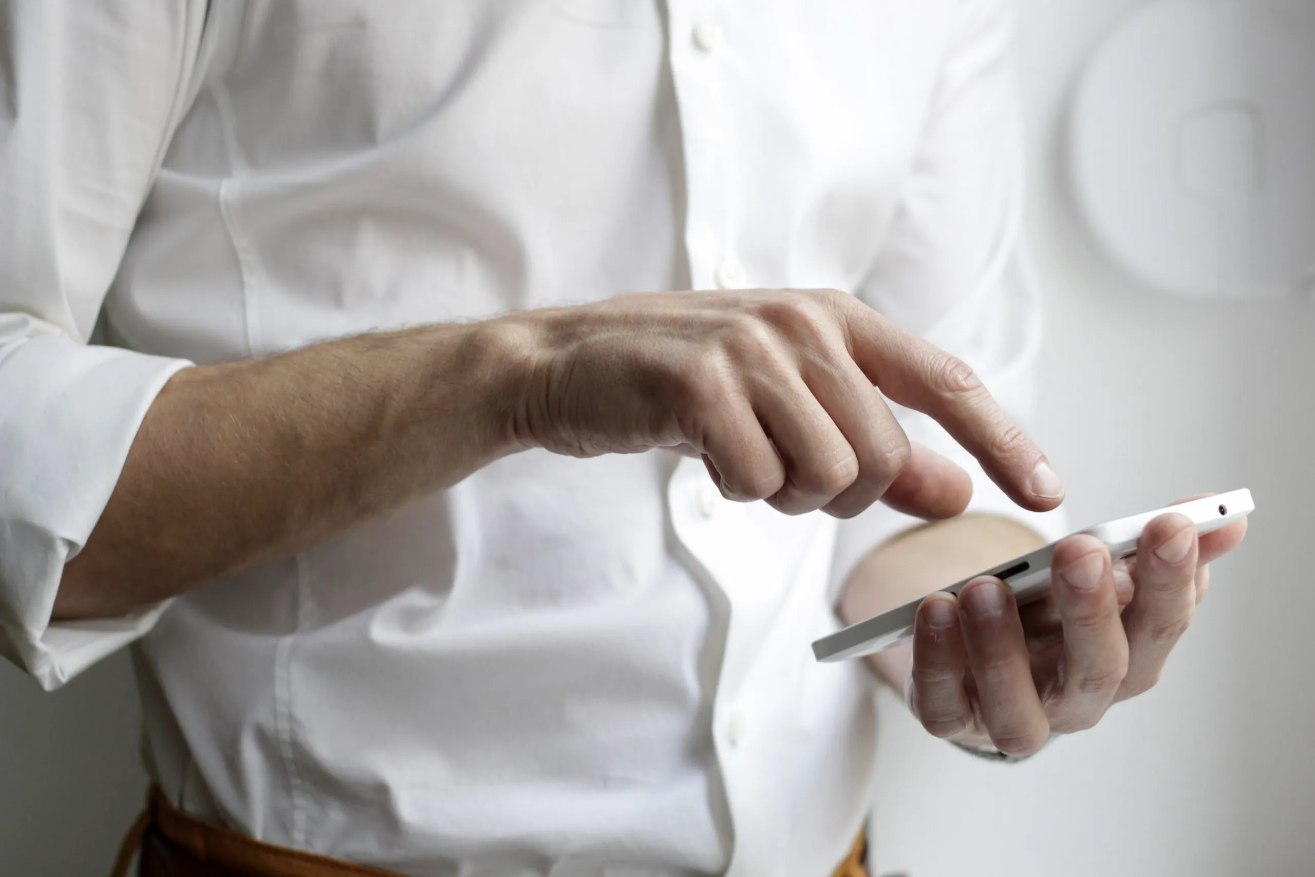 man dialing phone number of his insurance agency for policy and quote information